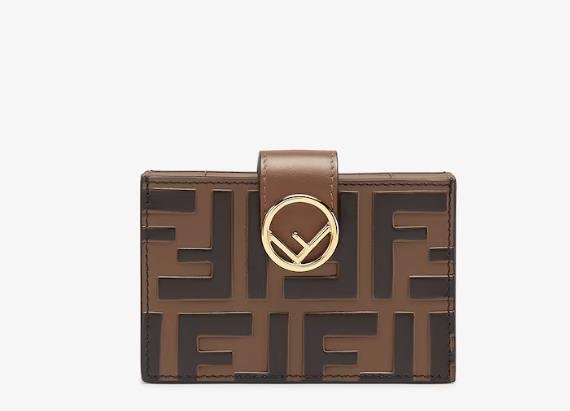 Luxury Fendi card holder in brown leather with embossed logo on front