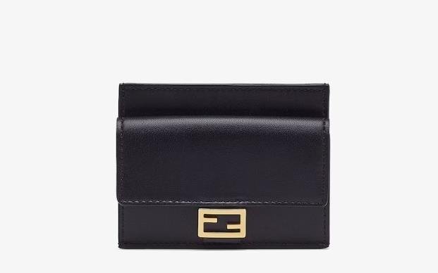 Stylish Fendi card holder in tan leather with embossed logo on front