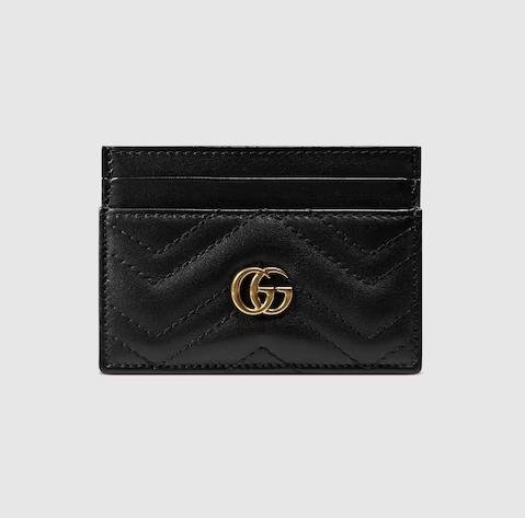 Black leather Gucci card holder with gold logo detailing