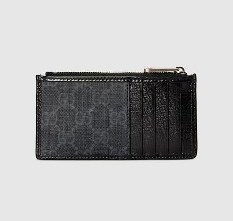 Stylish Gucci card holder in classic black leather with elegant gold accents