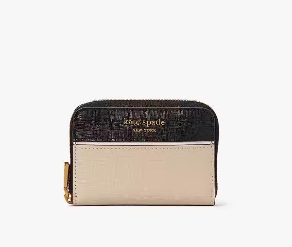Sophisticated card holder by Kate Spade with sleek design and luxurious gold accents