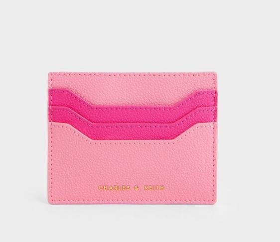 Stylish pink card holder with compartments for cards