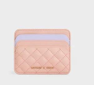 Chic pink card holder with modern design and convenient card storage slots