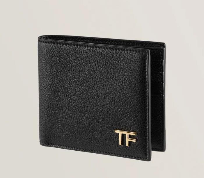 Luxurious Tom Ford card holder in rich burgundy leather with elegant logo engraving
